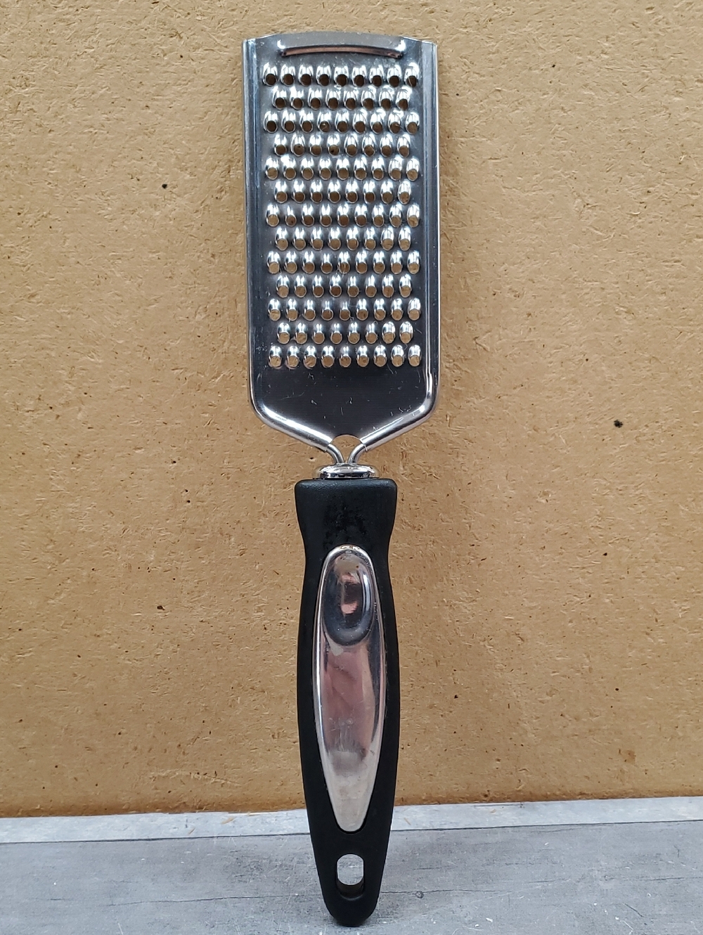 Stainless Steel Handheld Grater with Black Handle